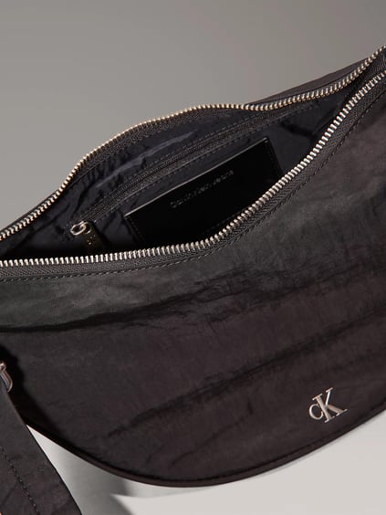 Calvin Klein Calvin Klein Kadın Ayarlanabilir Omuz Askılı Fermuarlı İç Bölmeli Metalik Ck Logolu Siyah Omuz Çantası LV04K3095G-UB1