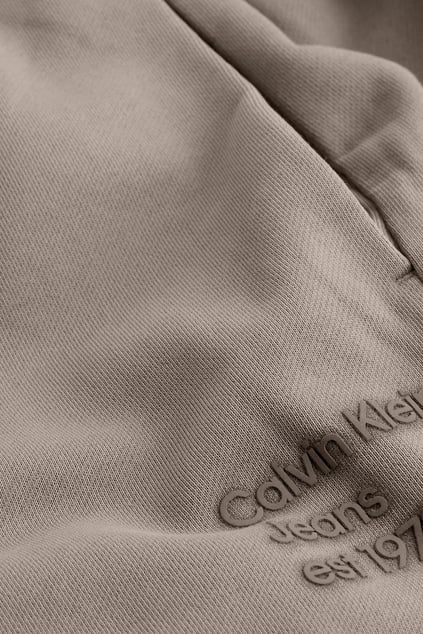 Calvin Klein Calvin Klein Kadın Normal Kesim Geniş Paça Dokuma Kumaş Beli ve Paçası Lastikli Bej Eşofman Altı J20J224989-PFW