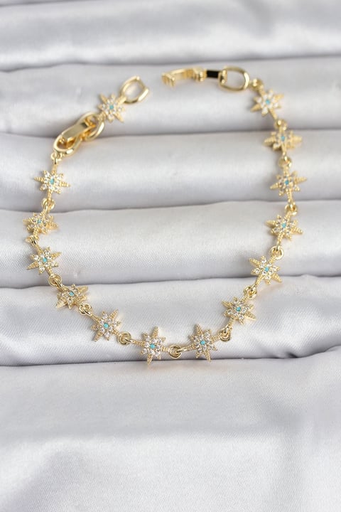 Pirinç Gold Renk Zirkon Taşlı Sıralı Kutup Yıldızı Model Kadın Bileklik