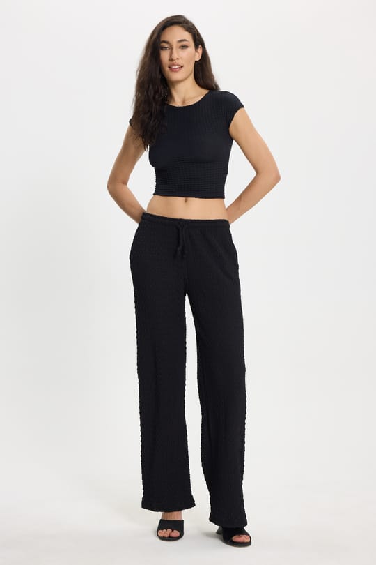 Kadın Slim Fit Dar Kesim Bisiklet Yaka Kolsuz Dokulu Siyah Bürümcük Bluz
