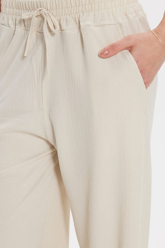Kadın Regular Fit Klasik Kesim Pamuklu Beli Bağcıklı Desenli Çift Cepli Krem Pantolon