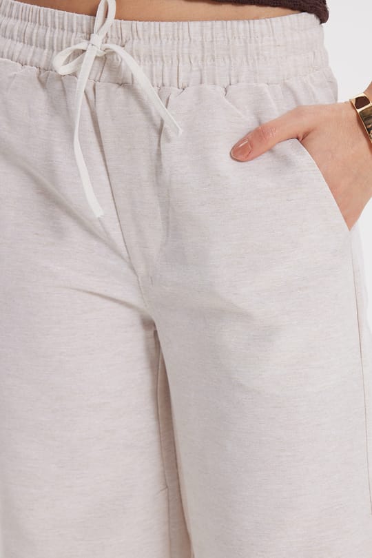 Kadın Regular Fit Klasik Kesim Pamuklu Beli Bağcıklı Lastikli Keten Görünümlü Taş Palazzo Pantolon