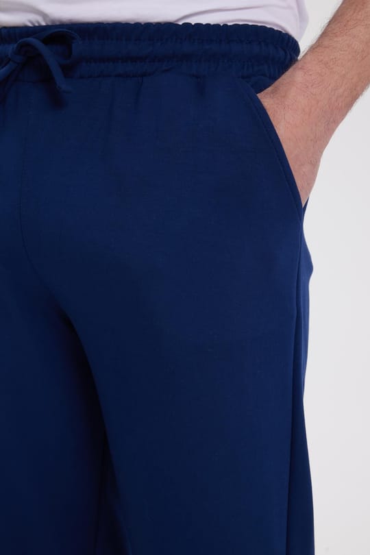 Erkek Slim Fit Dar Kesim Beli Bağcıklı 3 Cepli Geniş Paça Lacivert Eşofman Altı