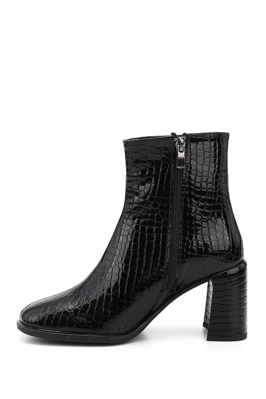 Black Krako-style flat-toe heeled zip-up women's shoes.