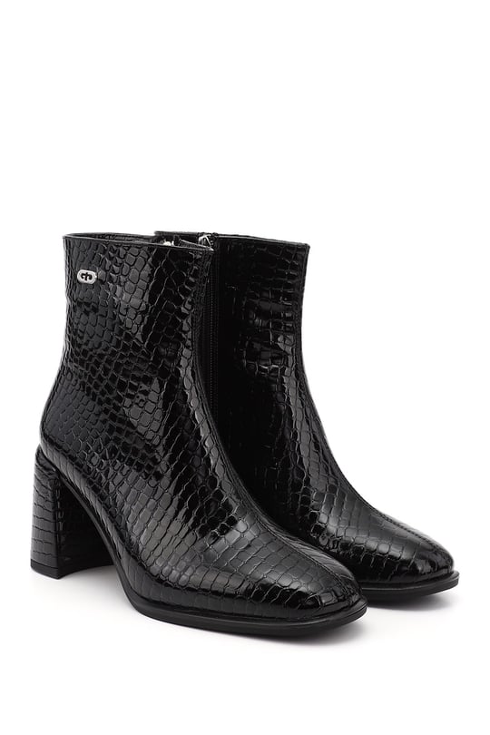 Black Krako-style flat-toe heeled zip-up women's shoes.