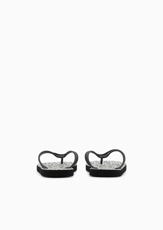 ARMANI EXCHANGE Armani Exchange Unısex Düz ve Rahat Taban Marka Logo Dokulu Parmak Arası Siyah-Beyaz Terlik XUQ002 XV676-N814