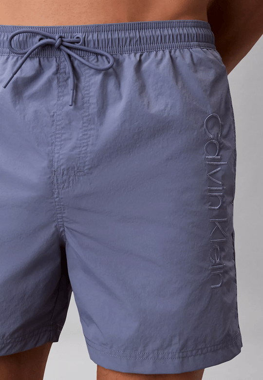 Calvin Klein Calvin Klein Erkek Beli Lastikli ve İp Bağlamalı Logo Detaylı Normal Kesim Lila Deniz Şortu LV00N61029-44J