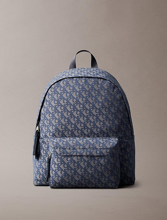 Calvin Klein Calvin Klein Erkek Fermuarlı Ön Cepli CK Monogram Logo Desenli Dizüstü Bilgisayar Bölmeli Gri Sırt Çantası LV04G3116G-K6B