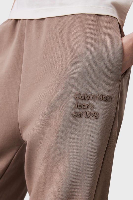 Calvin Klein Calvin Klein Kadın Normal Kesim Geniş Paça Dokuma Kumaş Beli ve Paçası Lastikli Bej Eşofman Altı J20J224989-PFW