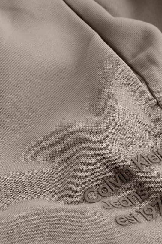 Calvin Klein Calvin Klein Kadın Normal Kesim Geniş Paça Dokuma Kumaş Beli ve Paçası Lastikli Bej Eşofman Altı J20J224989-PFW