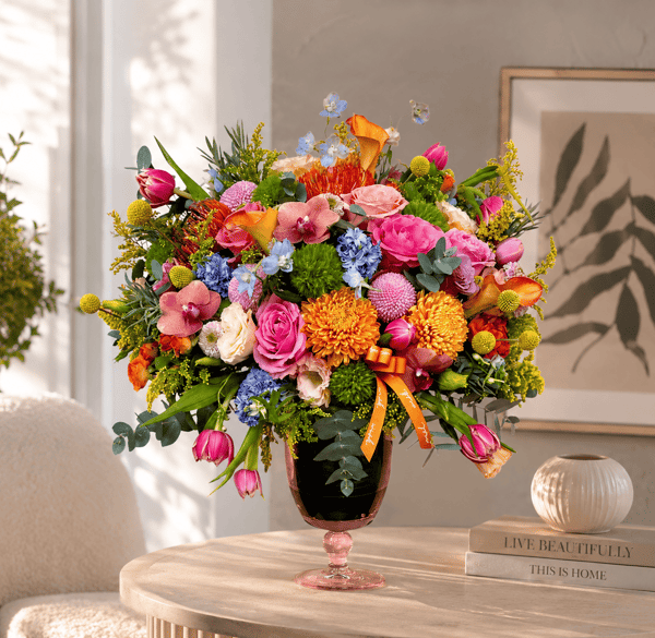 Flowers in a Glass Vase with Green Leaves