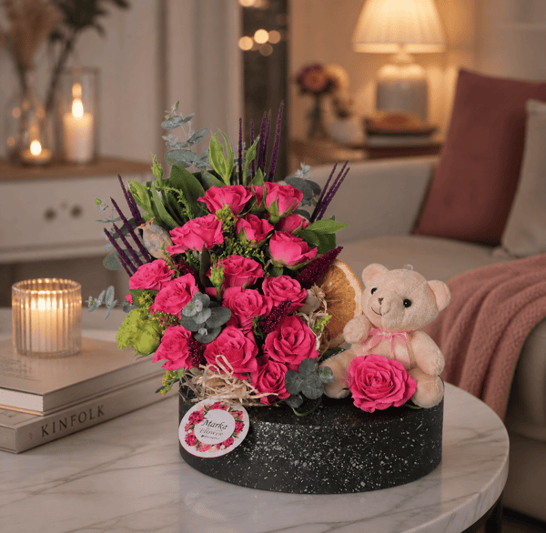 Pink Garden Roses in a boat-patterned pot