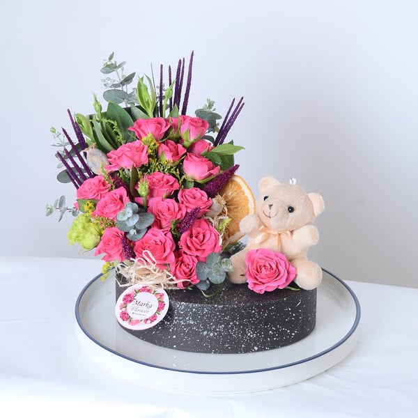 Pink Garden Roses in a boat-patterned pot
