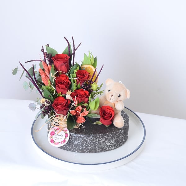 Red Roses in a Boat-Patterned Pot