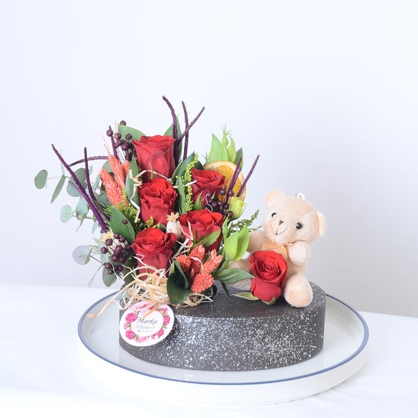 Red Roses in a Boat-Patterned Pot