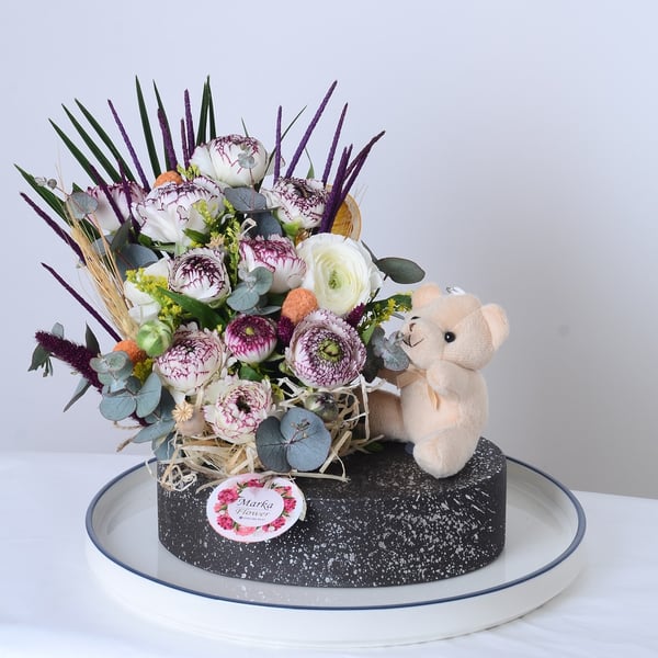 White Eren Roses in a boat-patterned pot