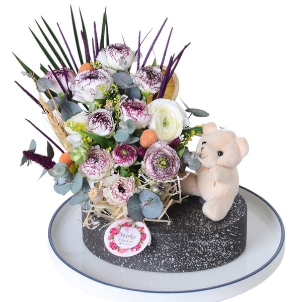 White Eren Roses in a boat-patterned pot
