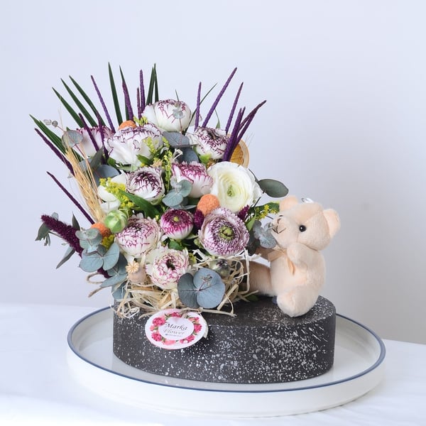 White Eren Roses in a boat-patterned pot