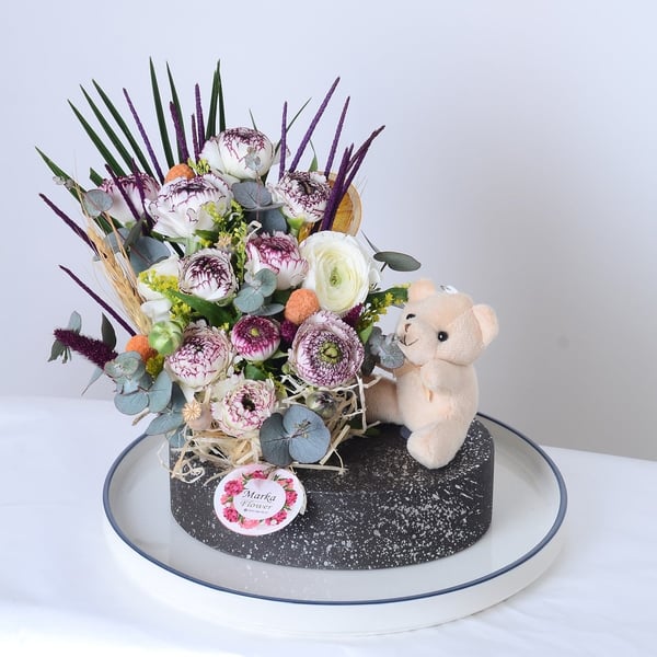 White Eren Roses in a boat-patterned pot