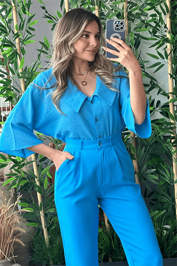 Mavi bebe yaka kolları volanlı gömlek