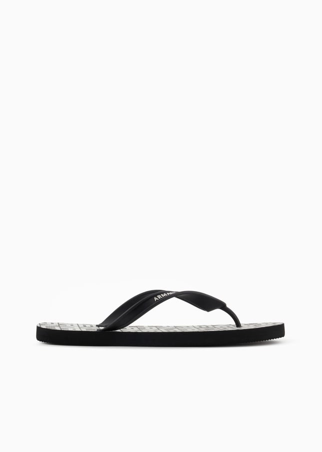 ARMANI EXCHANGE Armani Exchange Unısex Düz ve Rahat Taban Marka Logo Dokulu Parmak Arası Siyah-Beyaz Terlik XUQ002 XV676-N814