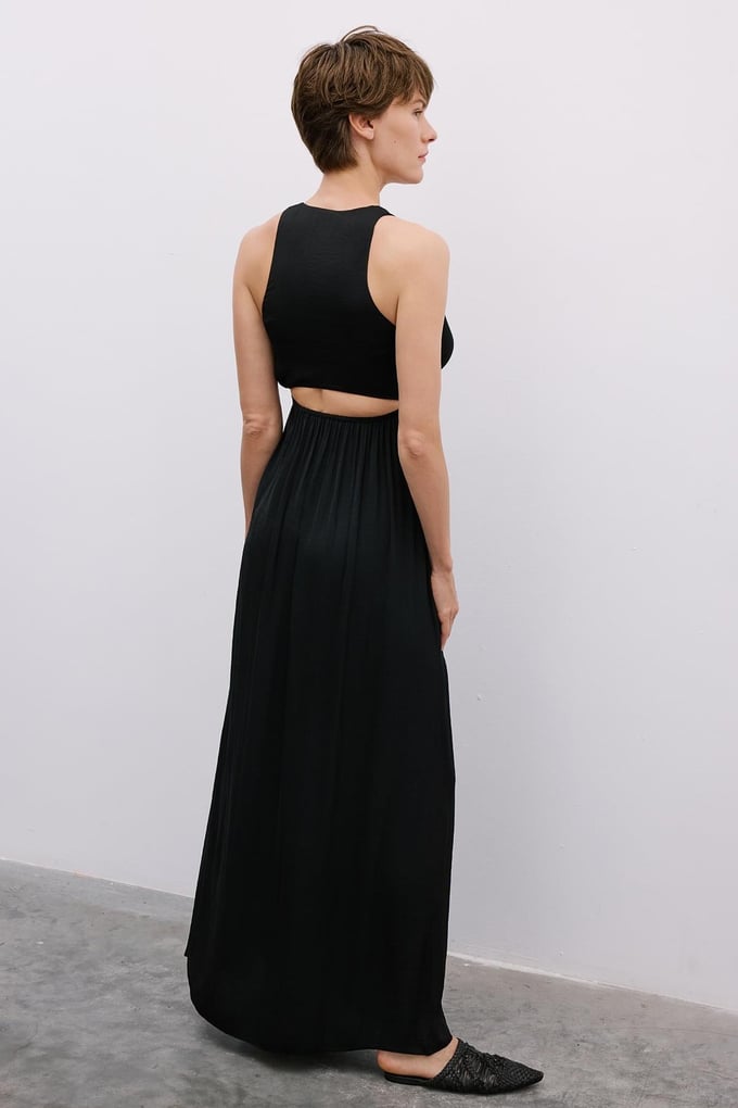 Long Black Cut-Out Dress with Gold Accessories