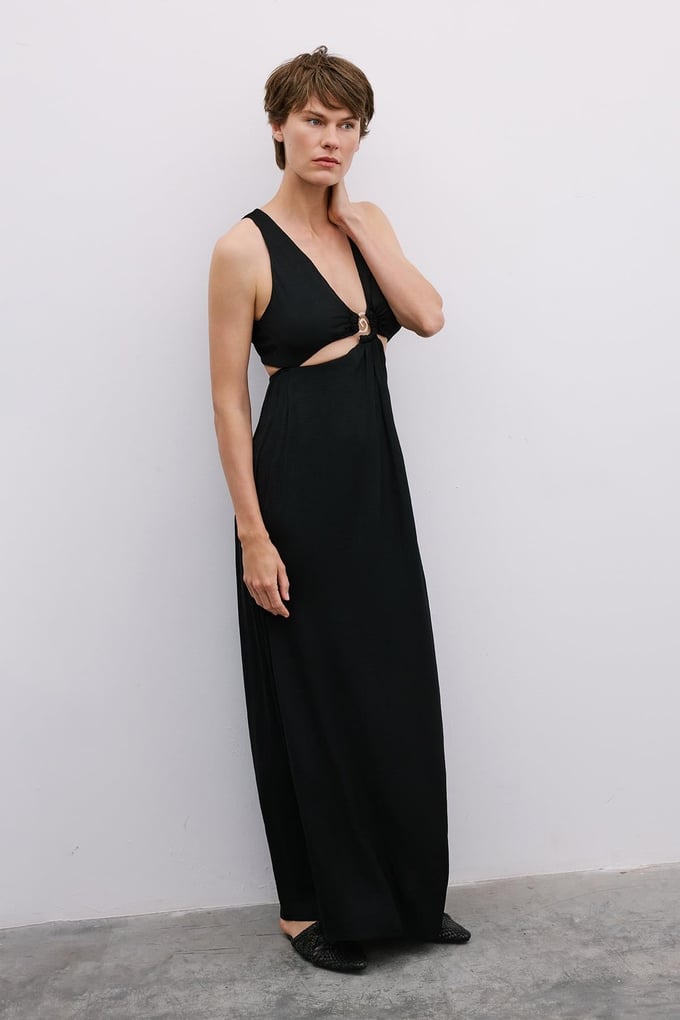 Long Black Cut-Out Dress with Gold Accessories