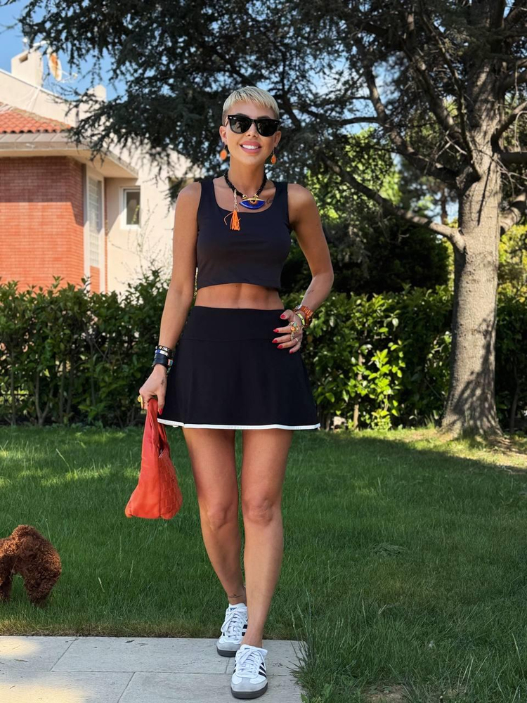 BLACK SKIRT WITH LINED SHORTS AND WHITE BINDING