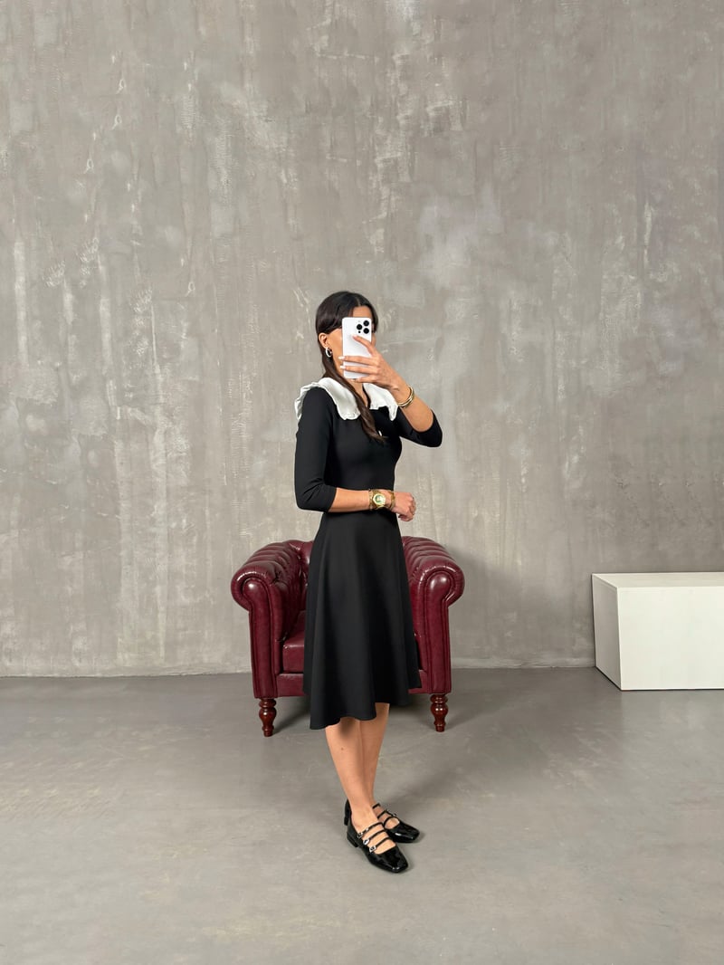 بريس ‎فستان أسود بياقة بيبي