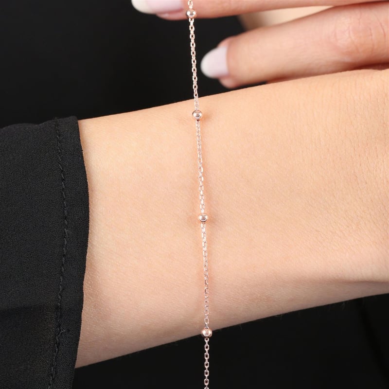 pariltili-toplar-rose-renk-gumus-bilek-304-ee.jpg