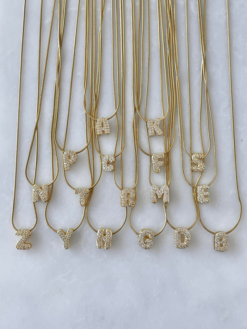 Çelik Gömme Taşlı Harf Kolye Gold