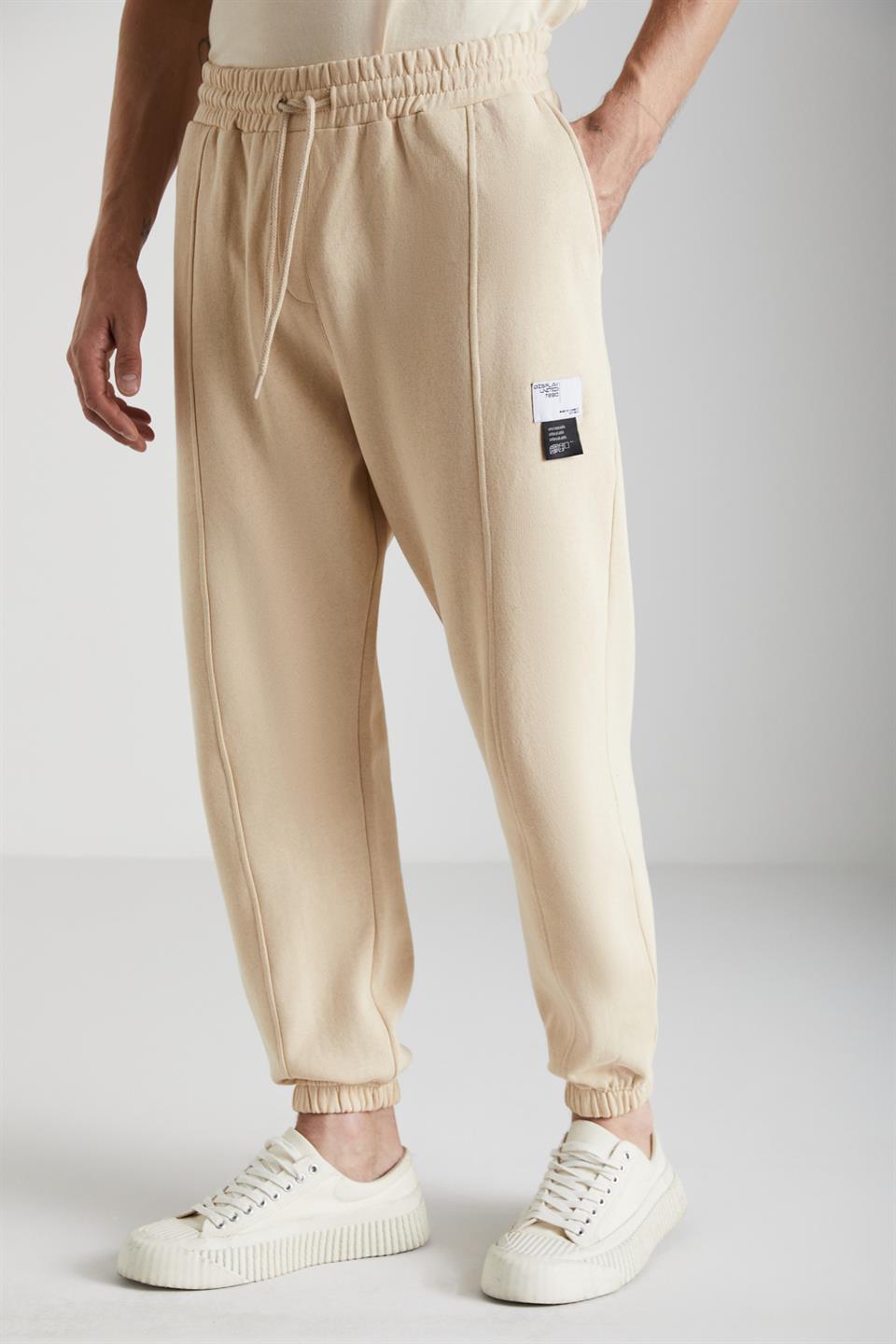 ROWAN Erkek Organik Pamuklu Relaxed Fit İçi Polarlı Süs Etiketli Jogger Vanilya Eşofman Altı